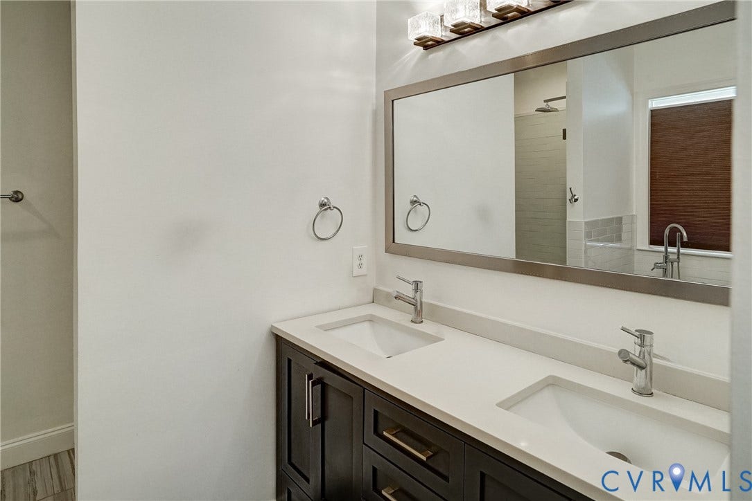8805 Eli Place, Kings Forest, Glen Allen, VA 23060 Double vanity with light-toned countertop, dual rectangular sinks, and chrome-finish faucets