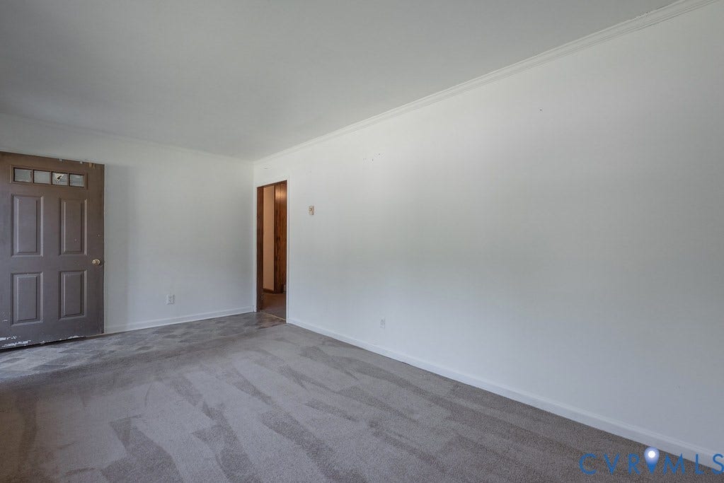 324 Lakewood Drive, Lakewood North, Petersburg, VA 23805 Neutral wall tones, gray carpeting, white trim, and crown molding