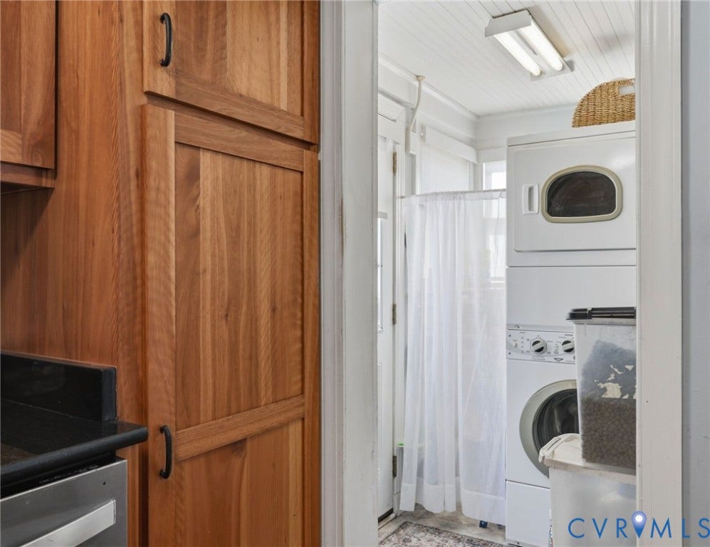 Wood-finish cabinetry with black hardware