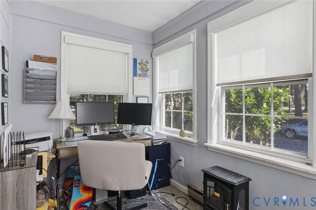Light gray walls complement the white trim and window frames, creating a neutral backdrop