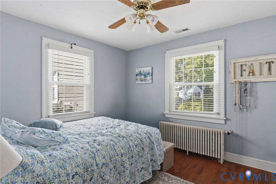 Hardwood flooring, painted walls, and window treatments