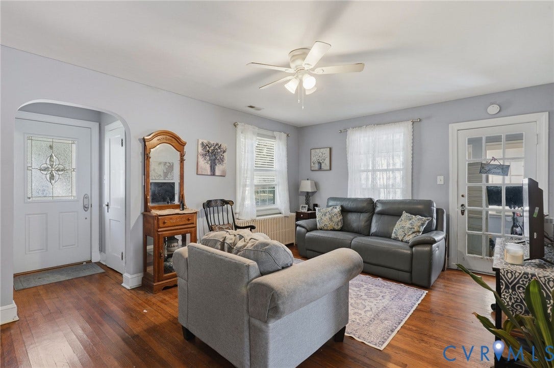 Hardwood flooring with an arched entryway