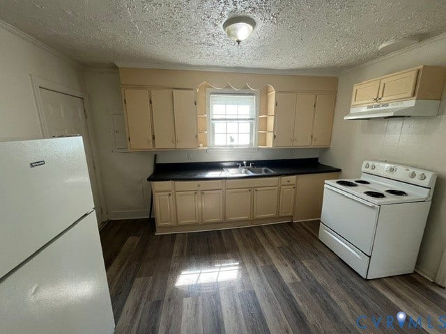 1227 Montgomery Avenue, Birdville Park, Petersburg, VA 23803 Kitchen featuring wood-finish flooring, a window, and a built-in range