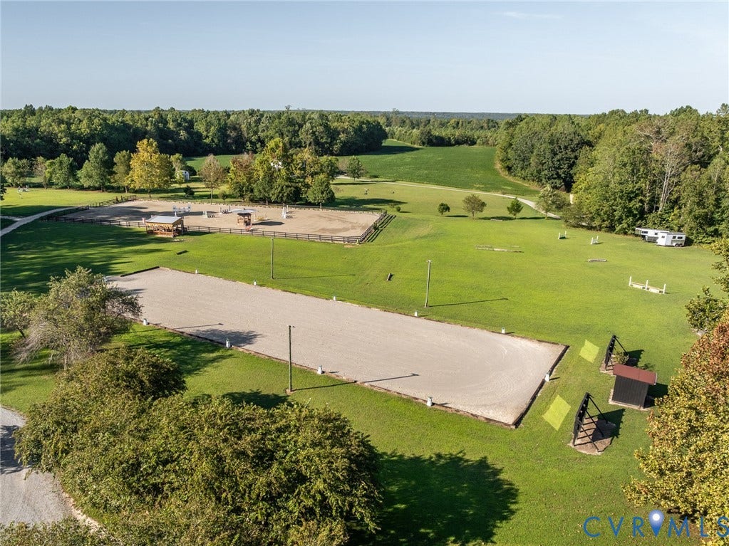 Multiple dedicated training areas include the main ring, dressage arena, grass derby field, mini cross country field, and round pen.