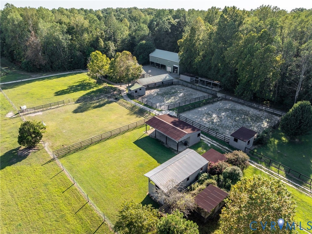 Aerial view of Pastures, Equipment Building,  Barn 3, Barn 4, and the two stalls with dedicated all-weather turnout.