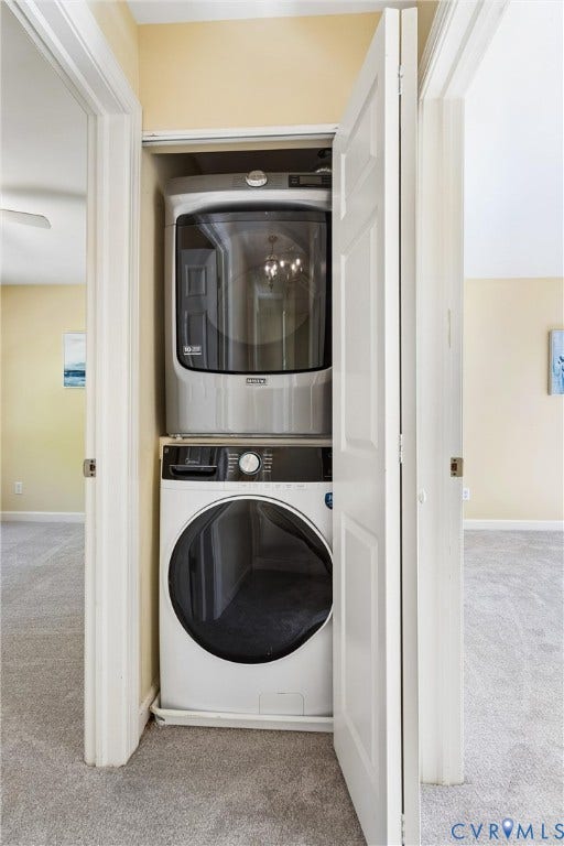 Stacked laundry appliances within a dedicated closet