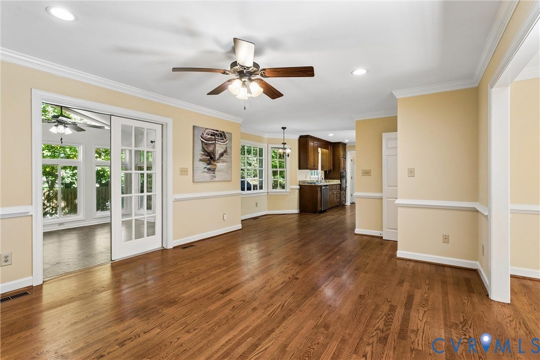 Hardwood flooring throughout, recessed lighting, crown molding, double French doors, and ceiling fans
