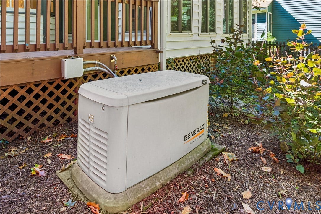 Whole-home generator, wood-finish deck with lattice skirting, and established landscaping
