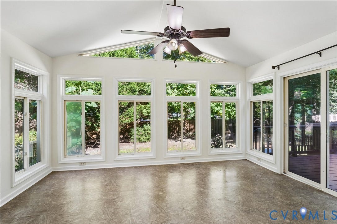 Vaulted ceiling with a ceiling fan and light fixture