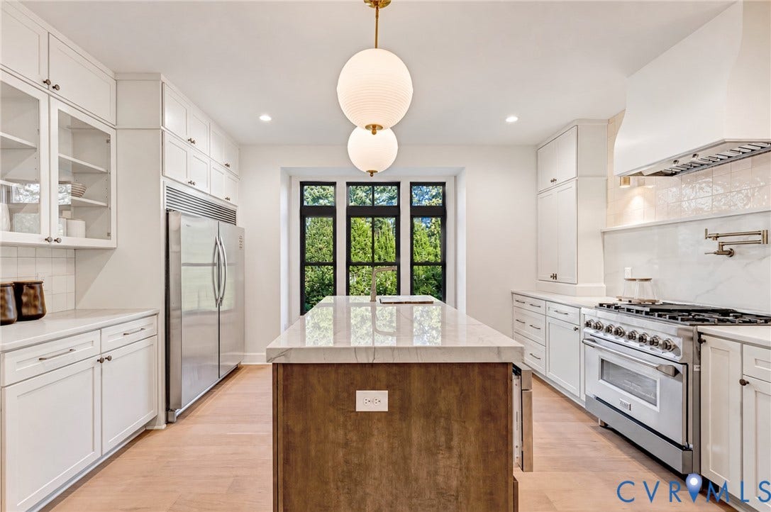 404 Waveny Road, Westham, Henrico, VA 23229 Kitchen featuring a central island with a stone-finish countertop, custom cabinetry, stainless steel professional-grade range, wood-finish flooring, and globe-style pendant lighting