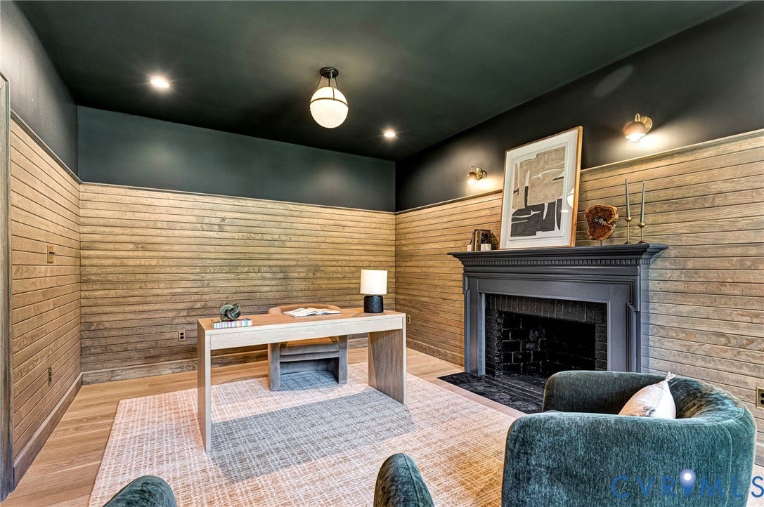404 Waveny Road, Westham, Henrico, VA 23229 Horizontal wood plank wall paneling, painted fireplace surround with brick insert, recessed lighting, and wall-mounted light fixtures