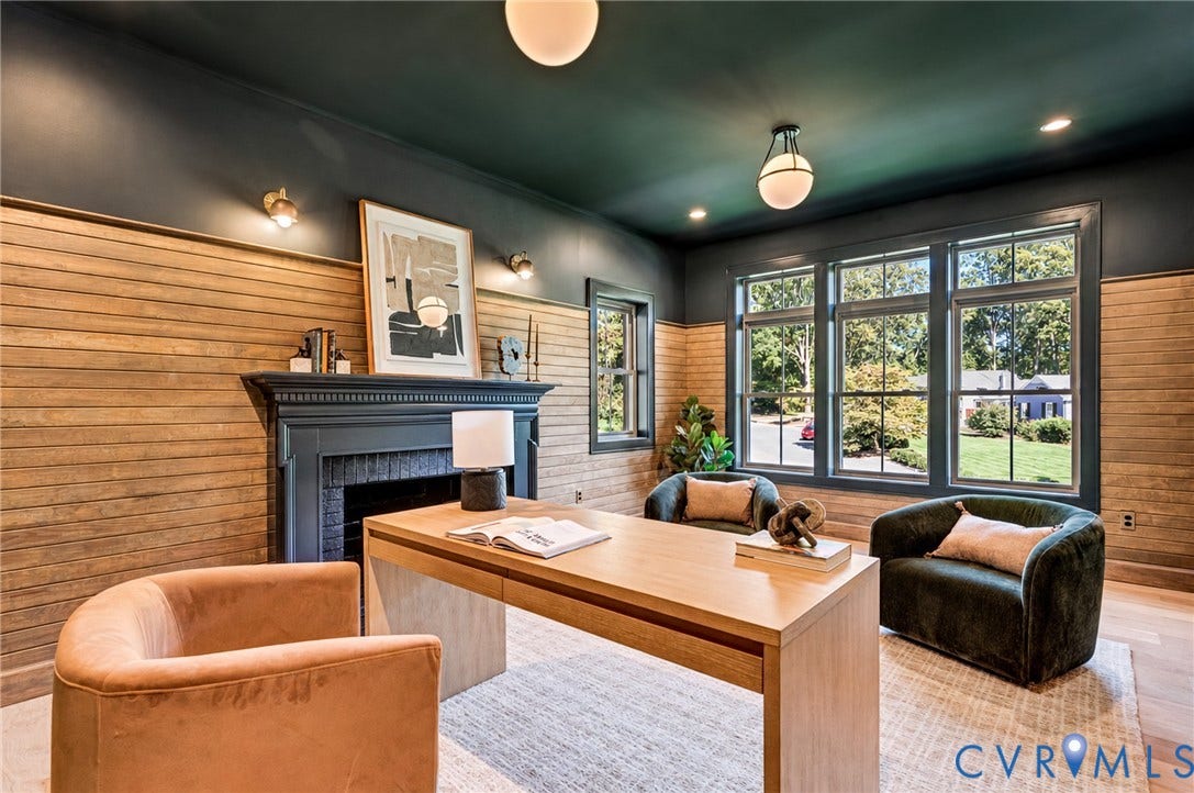 404 Waveny Road, Westham, Henrico, VA 23229 Horizontal wood plank wall paneling, painted fireplace mantle, multi-pane windows, wood-finish flooring, and globe-style lighting fixtures