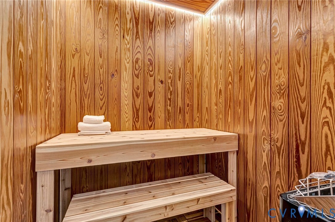 404 Waveny Road, Westham, Henrico, VA 23229 Sauna featuring vertical wood paneling, tiered wood bench seating, and integrated cove lighting