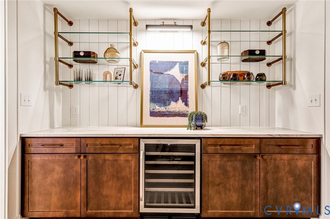 404 Waveny Road, Westham, Henrico, VA 23229 Custom cabinetry with integrated wine cooler, stone countertop, vertical shiplap wall paneling, and metallic wall-mounted shelving units