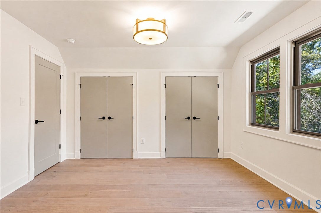 404 Waveny Road, Westham, Henrico, VA 23229 Wood-finish flooring, two sets of double-door closets, contemporary drum ceiling light fixture, neutral interior paint, and double-hung windows