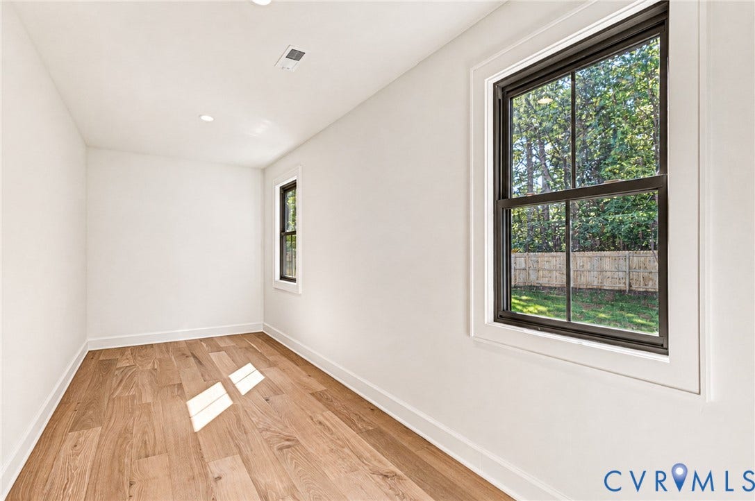 404 Waveny Road, Westham, Henrico, VA 23229 Interior space featuring wood-finish flooring, recessed lighting, and dark-framed windows with exterior trim