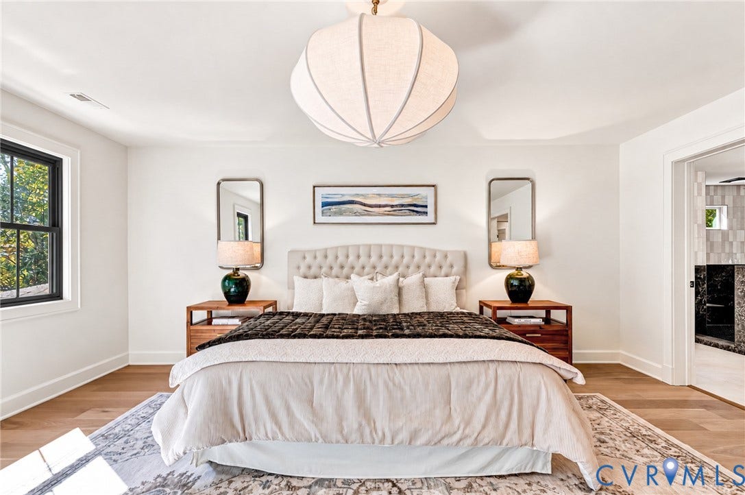 404 Waveny Road, Westham, Henrico, VA 23229 Wood-finish flooring, crisp white walls, and a prominent sculptural pendant light fixture