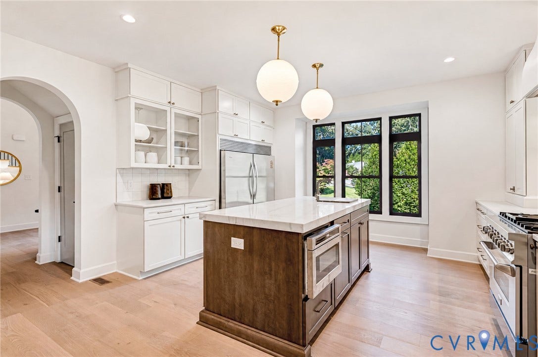 404 Waveny Road, Westham, Henrico, VA 23229 Kitchen featuring a center island with stone-style countertops, wood-finish flooring, custom shaker-style cabinetry, professional-grade stainless steel range, and dual globe pendant lighting