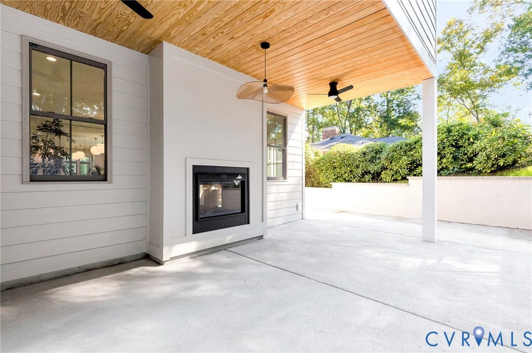 404 Waveny Road, Westham, Henrico, VA 23229 Covered patio featuring a wood-plank ceiling, built-in outdoor fireplace, concrete flooring, ceiling fan, and pendant lighting