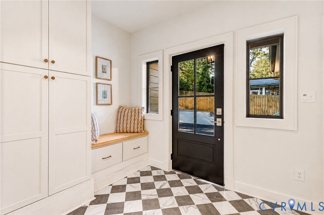 404 Waveny Road, Westham, Henrico, VA 23229 Entryway featuring checkerboard tile flooring, built-in floor-to-ceiling cabinetry, a custom bench with storage drawers, and a multi-pane door with black hardware