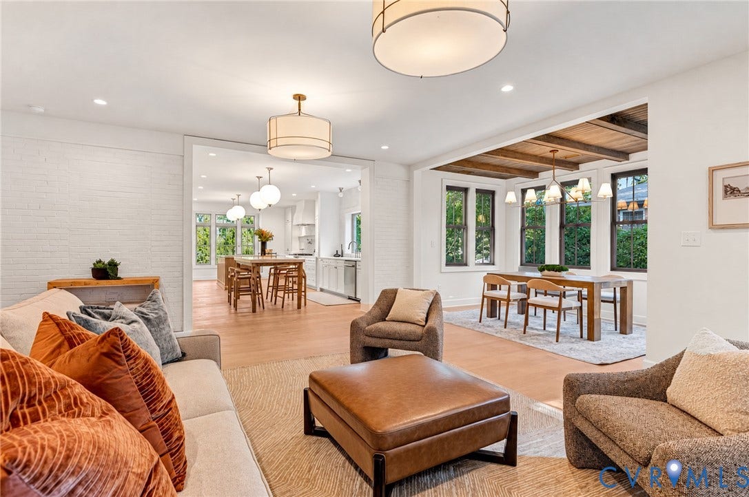 404 Waveny Road, Westham, Henrico, VA 23229 Open-concept area featuring white-painted brick walls, wood-finish flooring, recessed lighting, drum-style chandeliers, and exposed wooden ceiling beams