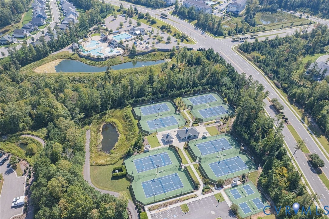 7101 Desert Candle Drive, Moseley, VA 23120 Multiple tennis courts, dedicated pickleball courts, and a swimming pool complex
