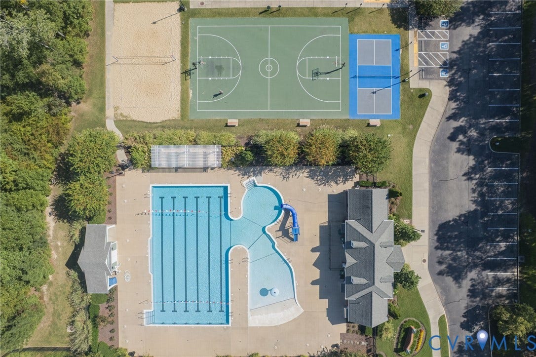 7101 Desert Candle Drive, Moseley, VA 23120 Outdoor amenities featuring a multi-lane lap pool, freeform pool with slide, clubhouse, basketball court, and sand volleyball court