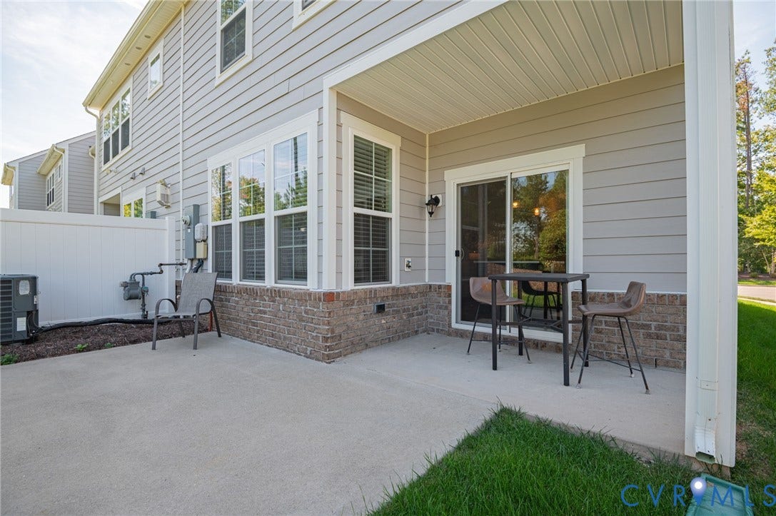 7101 Desert Candle Drive, Moseley, VA 23120 Covered patio with a concrete surface, sliding glass door