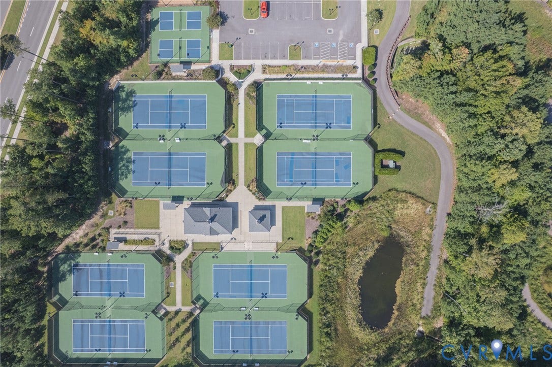 7101 Desert Candle Drive, Moseley, VA 23120 Multiple tennis courts, dedicated pickleball courts, manicured landscaping, paved walking paths, and a central pavilion