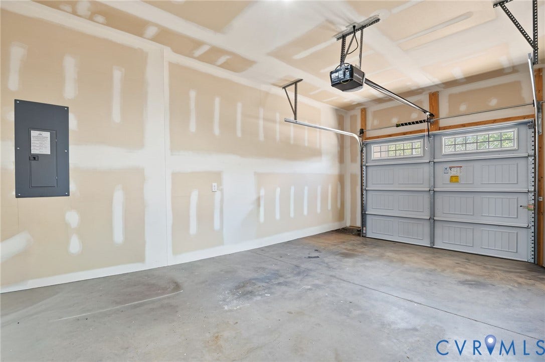 7101 Desert Candle Drive, Moseley, VA 23120 Attached garage with a concrete floor, automatic garage door opener
