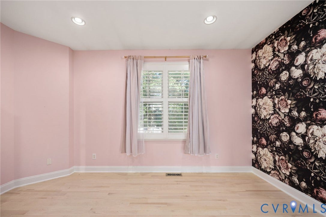 Spacious bedroom w/ primary bedroom access. Perfect for a nursery, office, bedroom or flex space.