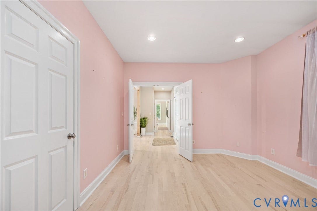 Spacious bedroom w/ primary bedroom access. Perfect for a nursery, office, bedroom or flex space.