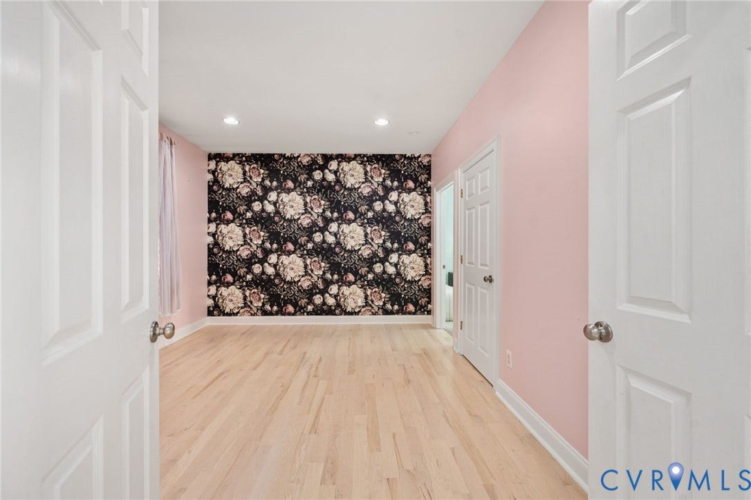Spacious bedroom w/ primary bedroom access. Perfect for a nursery, office, bedroom or flex space.