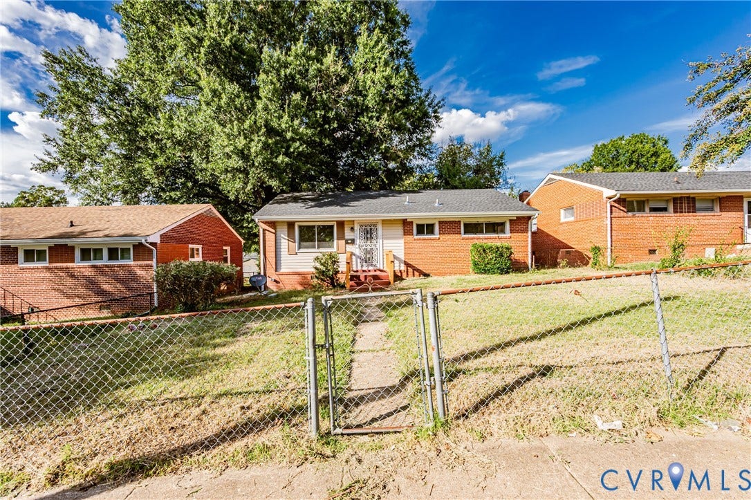 Brick ranch home situated on a spacious lot with mature landscaping and established trees
