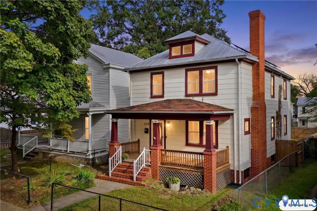 Front porch with brick pillars and wood railing