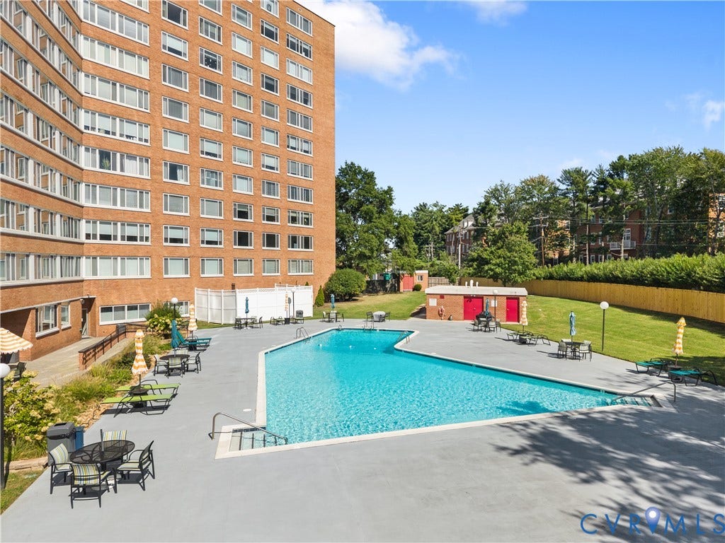 Outdoor swimming pool with integrated steps and metal handrails