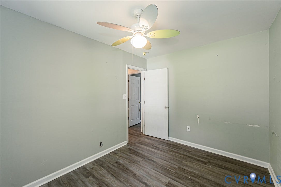 1st floor bedroom #1 Recessed ceiling lighting, wood-finish flooring, and multiple windows