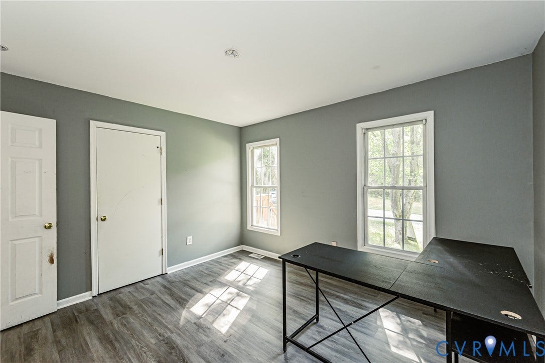1st floor bedroom #2 Recessed ceiling lighting, 1st floor bedroom #1 Recessed ceiling lighting, wood-finish flooring, and multiple windows