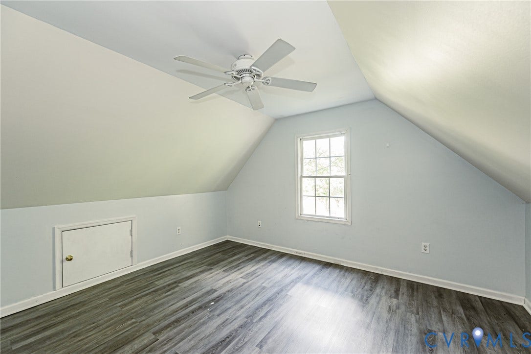 2nd floor bedroom #4 Sloped ceilings with a white ceiling fan and light fixture, wood-finish flooring, and a double-hung window
