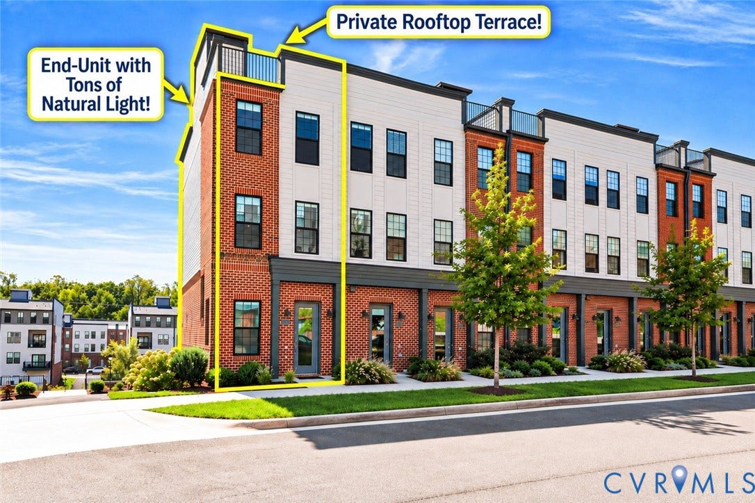 Brick and siding exterior featuring multiple windows, street-facing entrance, and a rooftop terrace