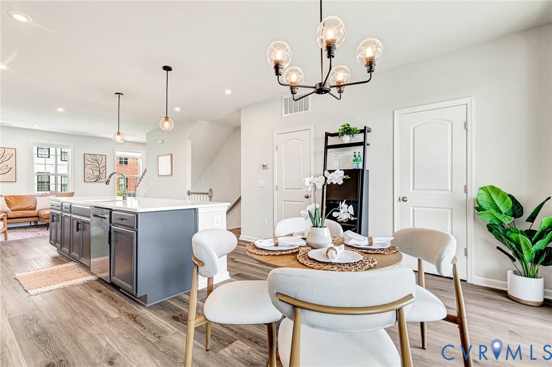 Spacious open-concept layout with wood-finish flooring
