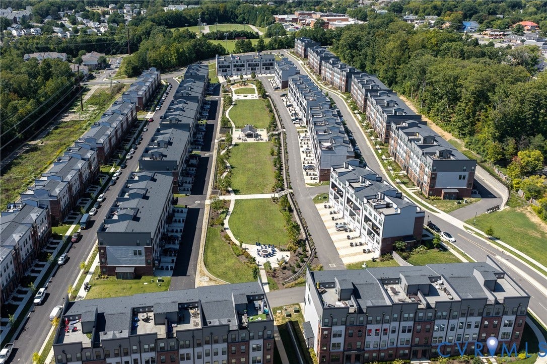 Modern multi-story residential buildings featuring varied exterior finishes