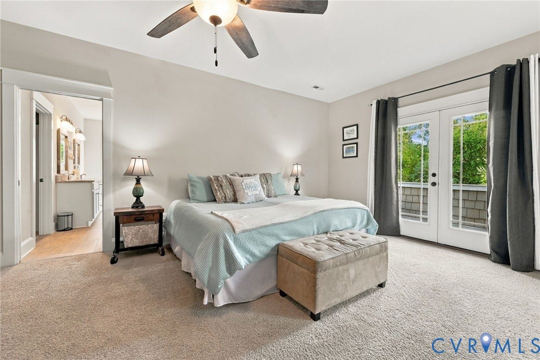 Second floor primary bedroom with balcony access