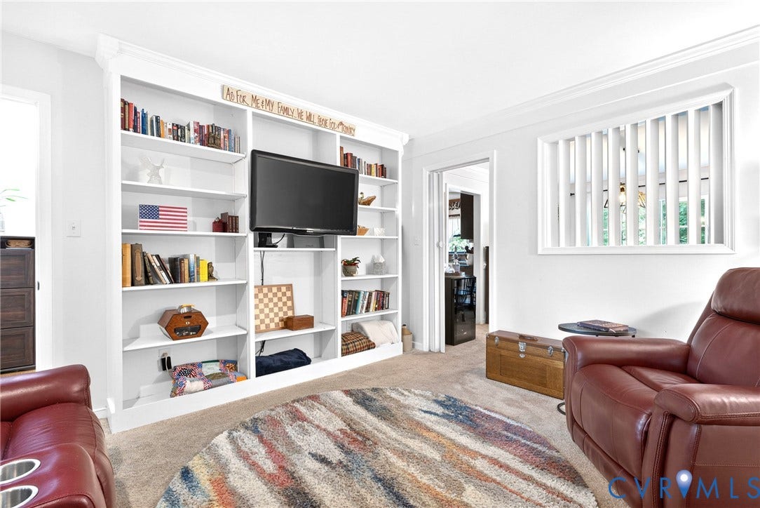 Also would be a great Home Office.  White shelving unit and Crown Molding