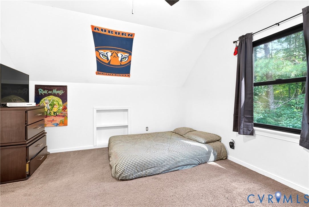 Bedroom 2  View 1 -  featuring built-in shelving alcoves and Ceiling Fan
