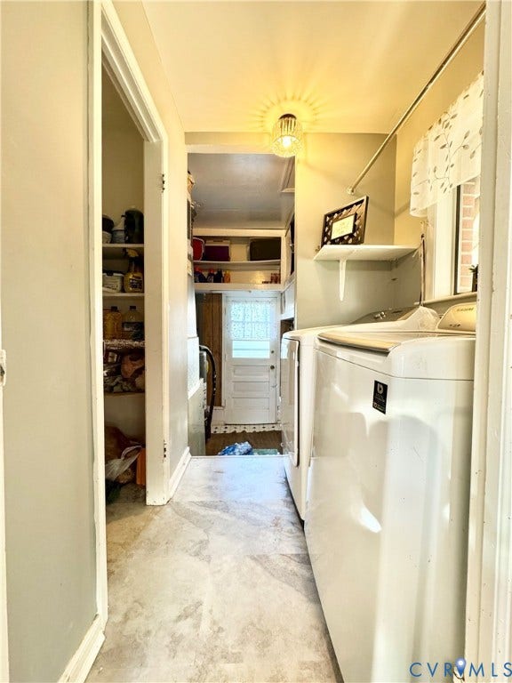 Appliance-ready utility space with a built-in shelf, overhead lighting, and a window