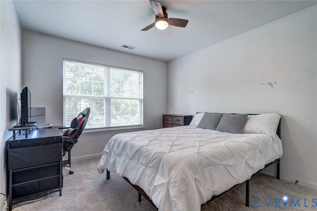 Recessed lighting, ceiling fan with integrated lighting, window with blinds, and neutral carpeting