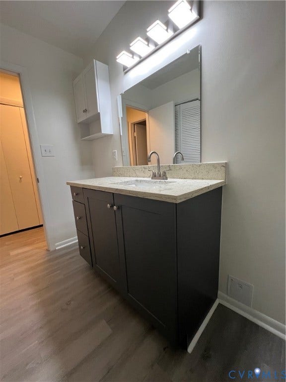 2112 Paramont Avenue, Collegue Park, Chesapeake, VA 23320 Modern vanity with a light-toned countertop, under-mount sink, and a wall-mounted rectangular mirror