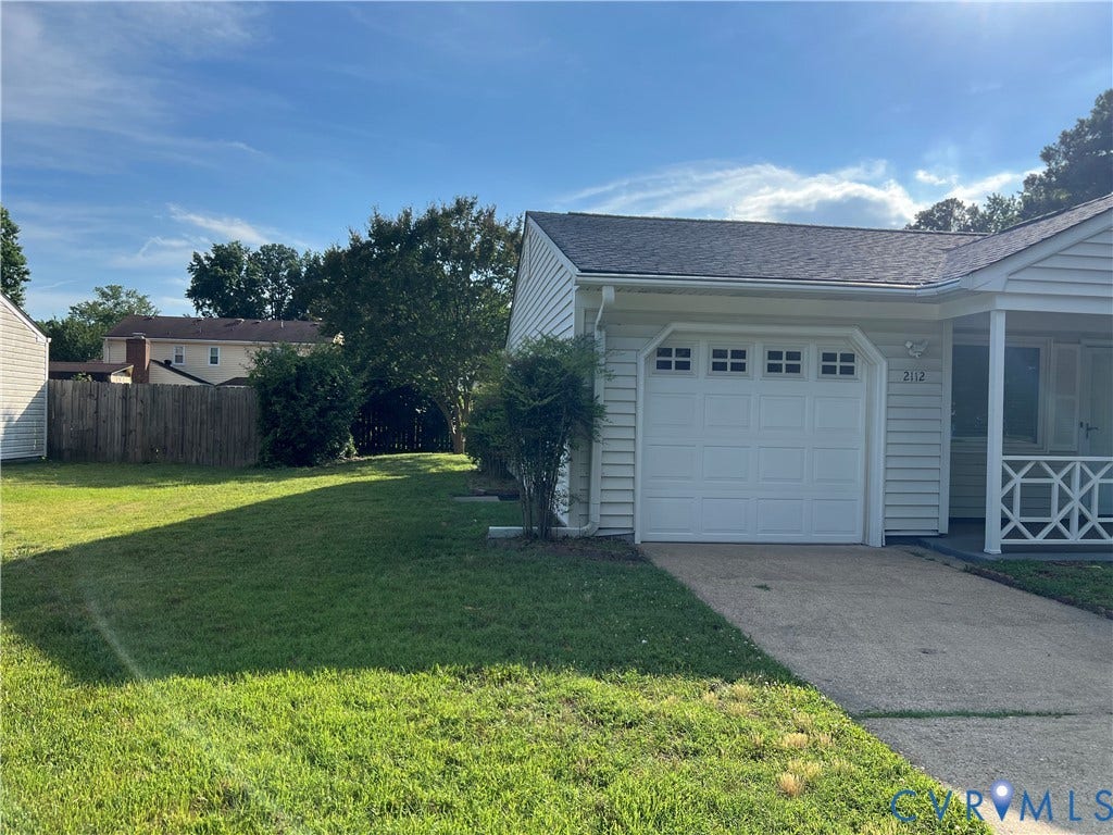 2112 Paramont Avenue, Collegue Park, Chesapeake, VA 23320 Attached garage with white panel door, asphalt shingle roof, siding exterior, covered entry porch, and concrete driveway