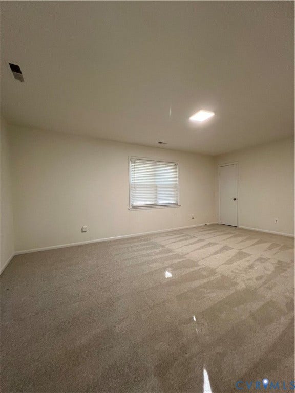 2112 Paramont Avenue, Collegue Park, Chesapeake, VA 23320 Carpeted flooring, neutral wall tones, window with horizontal blinds, flush mount ceiling light, and a white interior door
